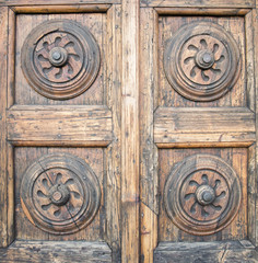 Details of an ancient Italian door in Florence, Italy.