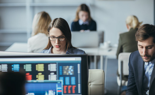 Traders working on computers