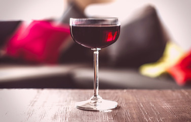 glasses of red wine on a wooden table