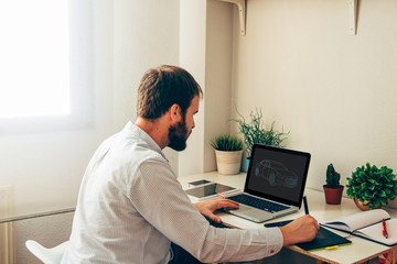 Graphic designer making a sketch of a car.