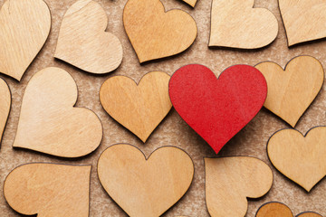 Wooden hearts on paper background