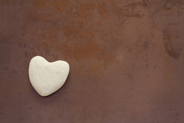 Obraz premium heart on ceramic brown background