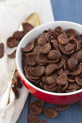 chocolate flakes in red bowl