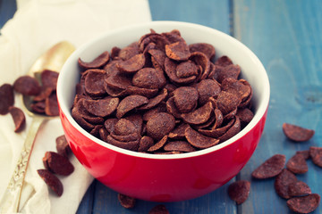 chocolate flakes in red bowl