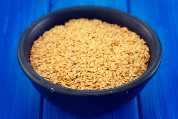 linen seeds in black bowl