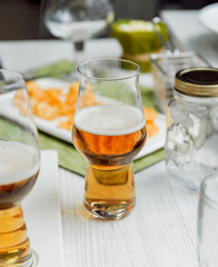 Beer and chips on the large white table