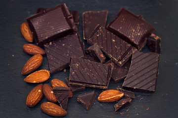 chocolate with almond on black background