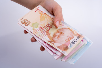Hand holding Turksh Lira banknotes  in hand