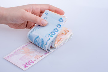 Hand holding Turksh Lira banknotes  in hand