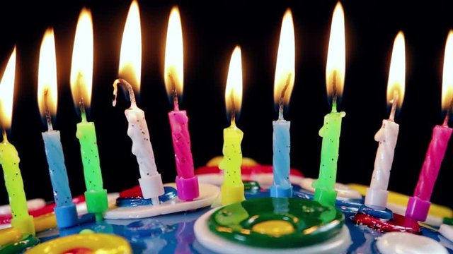 lighted candles on a birthday cake