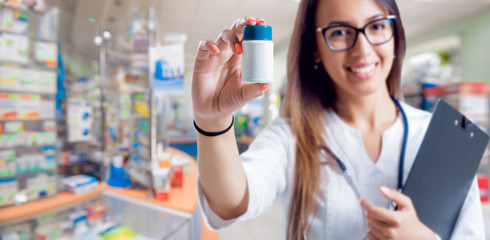 Pharmacist showing medication at the pharmacy