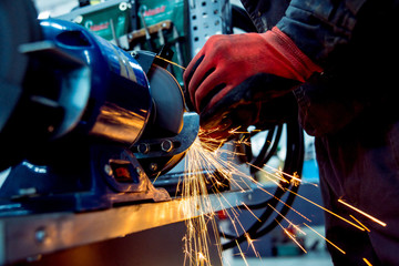 Grinding parts on a lathe.