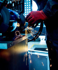 Grinding parts on a lathe.