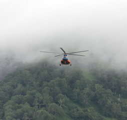 Fototapeta na wymiar Helicopter delivers environmentalists to Dvukhyurtochnoe Lake - Kamchatka, Russia