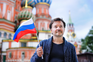 Middle age man holding russian flag