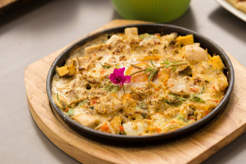 Hot plate Omelette eggs with salted fish and mushroom.