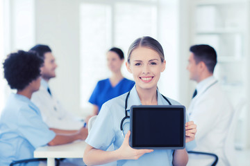 happy doctor over group of medics at hospital