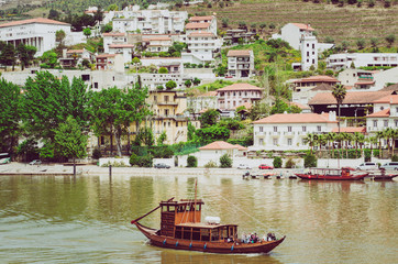 Little wooden boat on Duoro river in Pinhao,Portugal. View from Pinho vilage in Portugal to Douro valey