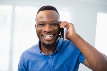 Portrait of man talking on mobile phone