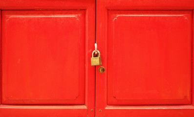 key and wooden with red color  background
