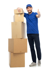 happy delivery man with boxes showing thumbs up
