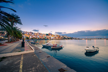 The pictursque port of Sitia, Crete at sunset. Sitia is a traditional town at the east Crete near the beach of palm trees, Vai.   - obrazy, fototapety, plakaty