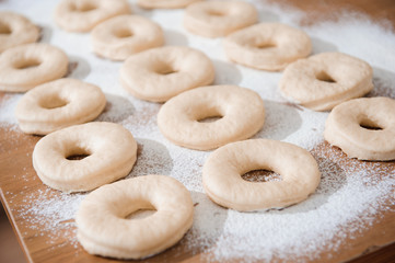 Chef preparing dough - cooking donuts process