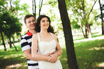 lovely happy couple  at summer park