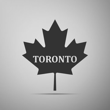 Canadian maple leaf with city name Toronto flat icon on grey background. Vector Illustration