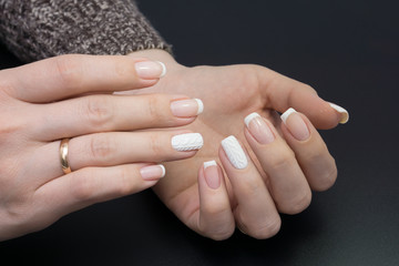 Fototapeta premium Beautiful hands and natural nails, ideal clean manicure. Decorated with stylish elements