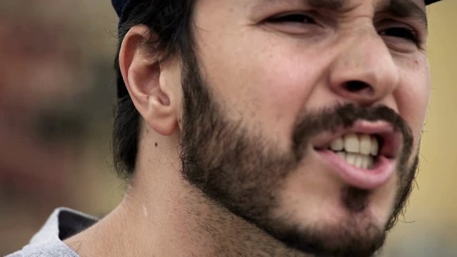  man in profile that is attacking someone verbally