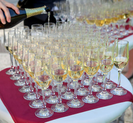 pouring champagne for guests