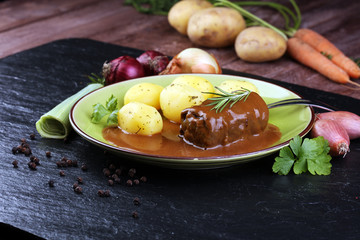 Tasty roulades beef on plate with potato, sauce, close up. beef