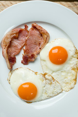 Overhead of Bacon and Eggs in White Plate