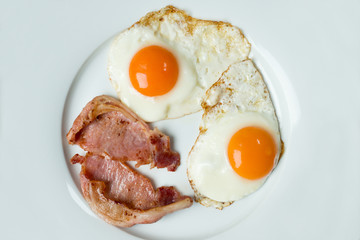 Overhead of Bacon and Eggs in White Tray