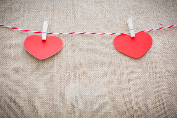 Love Valentine's hearts natural cord and white clips hanging © nipastock