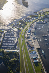 aerial view of an harbour, wtih marina, car park, ferry boat terminal a dike, Friesland, the Netherlands
