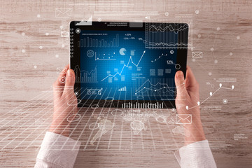 Business hands holding tablet