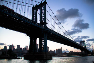 Manhattan bridge in silhouette in evening