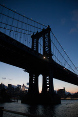 Manhattan bridge in silhouette at night, New York