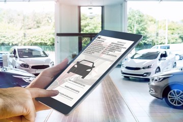 Composite image of man using tablet pc
