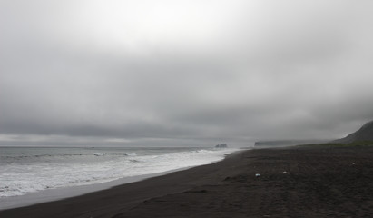 Khalaktyrsky beach with black volcanic sand near Petropavlovsk-Kamchatsky. Pacific ocean, Kamchatka peninsula, Russia.