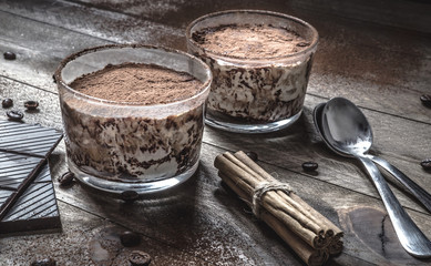 Coffee and cream dessert in glass on vintage table