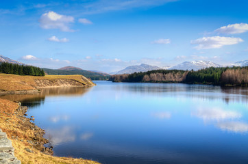 Fototapeta na wymiar Cloud reflections in a lake in Scotland