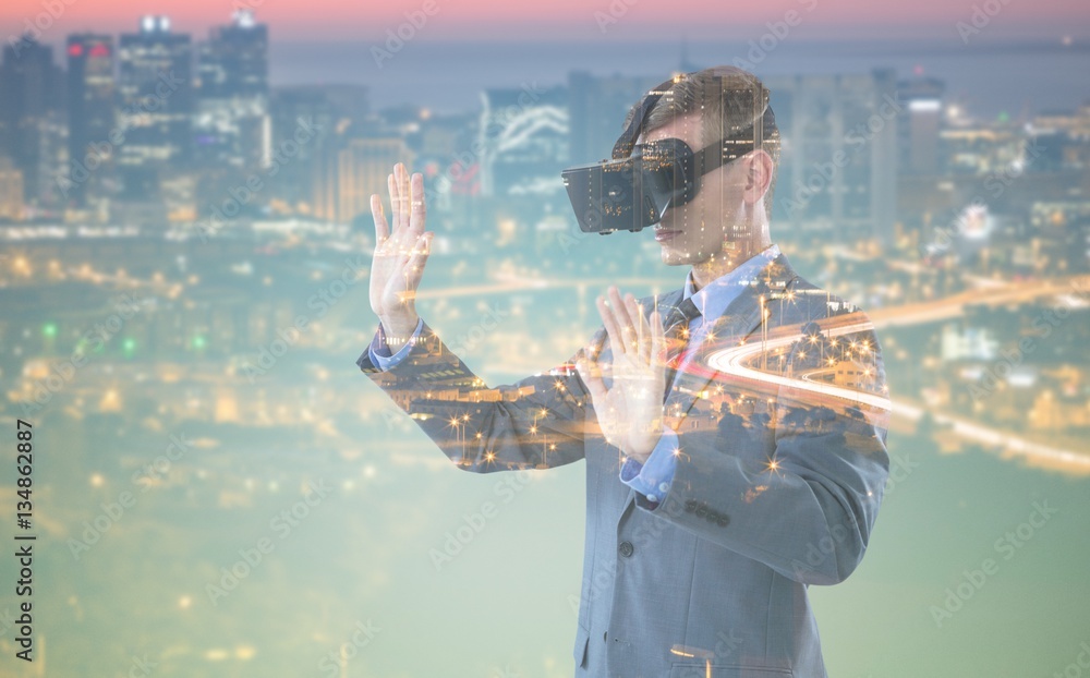 Poster composite image of businessman using virtual reality headset