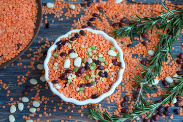 Lentils, legumes, peas, beans and rosemary - italian kitchen ingredients. Top view.
