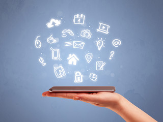 Hand holding tablet phone with drawn icons