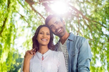 Portrait of couple smiling in park