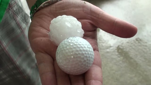 Golf Ball Hail Held in Hand
