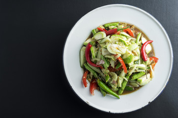 Tam Cucumber on black background .